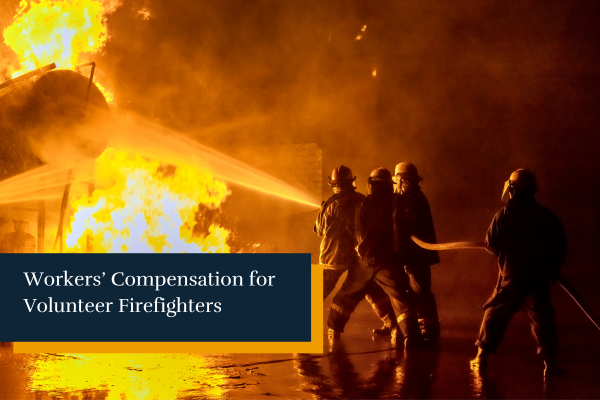 firefighters and volunteer firefighters extinguishing a fire on a building