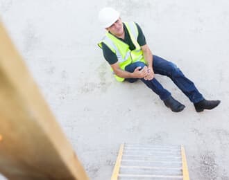 worker with knee injury at work