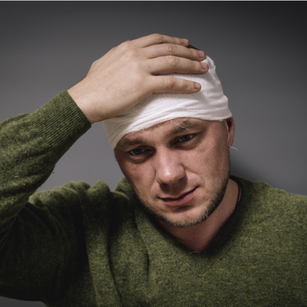 a man with a head tied by bandage