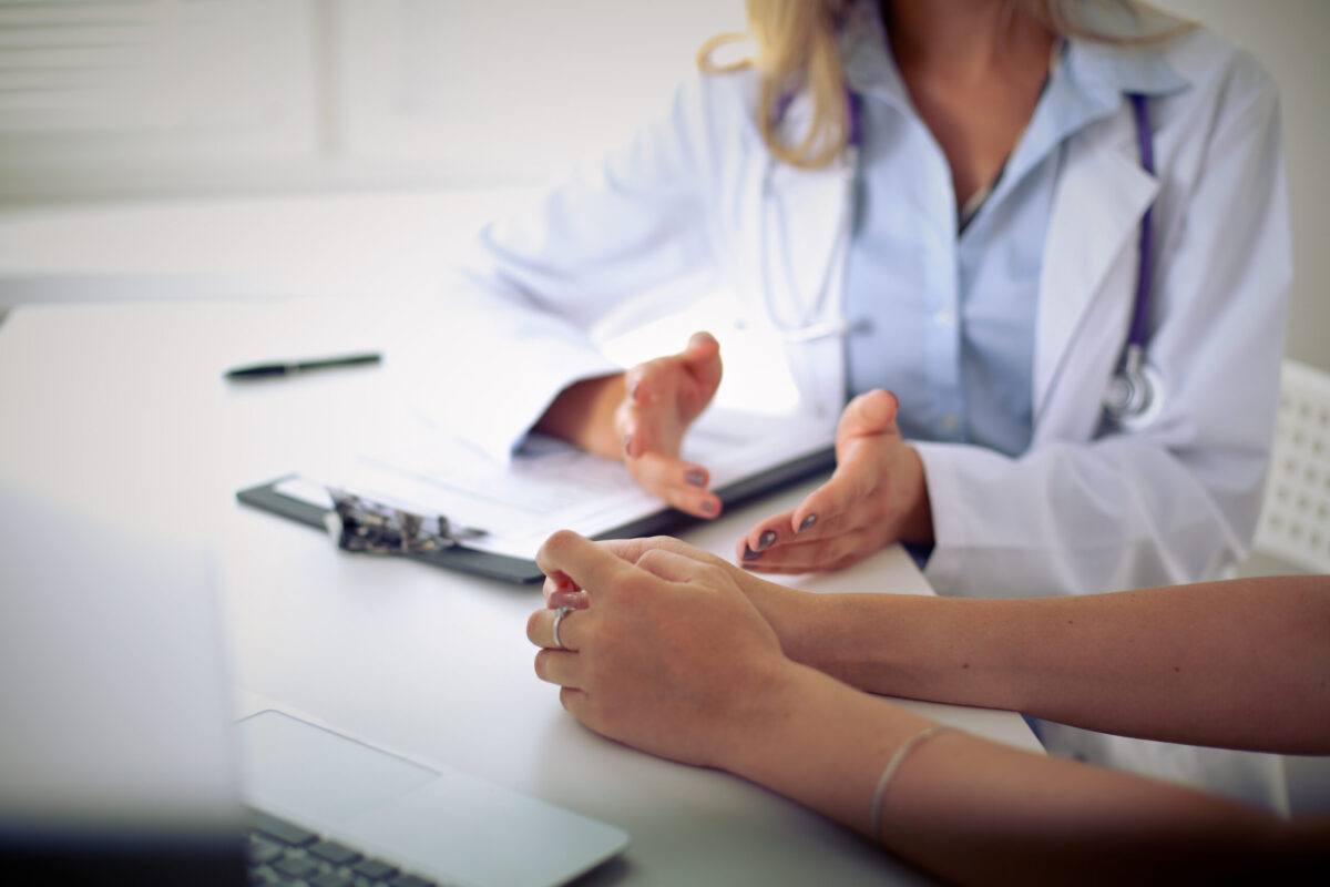 injured employee talking to doctor about depression symptoms