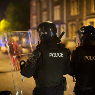 police officers trying to stop a riot